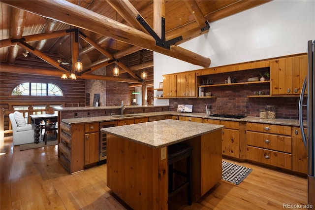 29095 Summit Ranch Dr, Golden, CO 80401 - kitchen featuring open shelves, a sink, wine cooler, wooden ceiling with exposed beams, and log walls