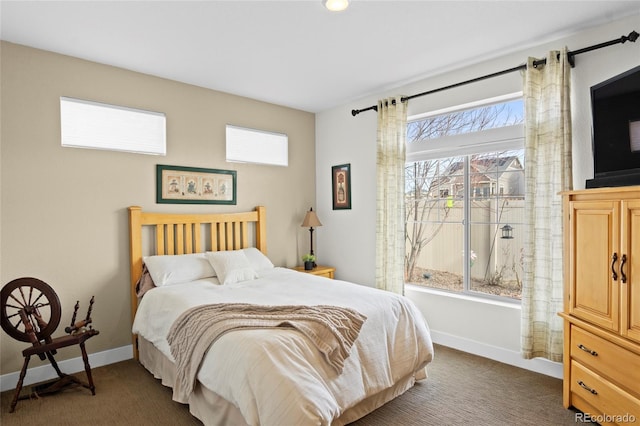 bedroom with dark carpet