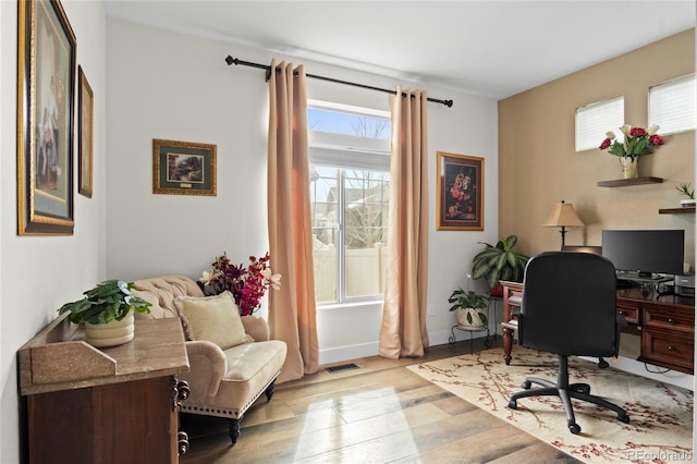 office area with light hardwood / wood-style flooring