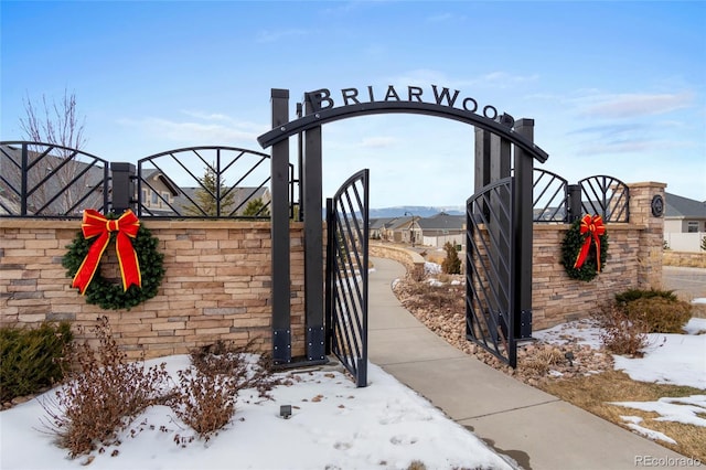 view of snow covered gate