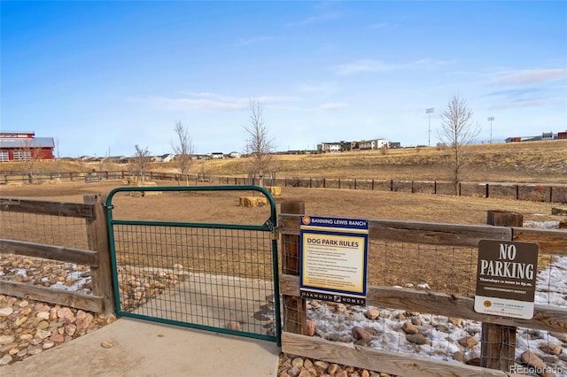 view of gate featuring a rural view