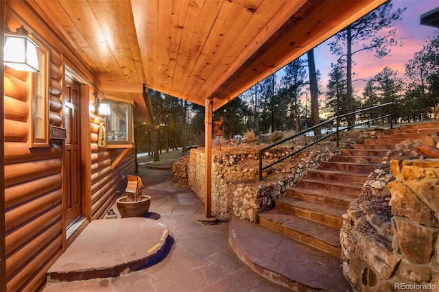 view of patio terrace at dusk