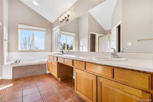 bathroom featuring tile patterned flooring, vanity, vaulted ceiling, and independent shower and bath