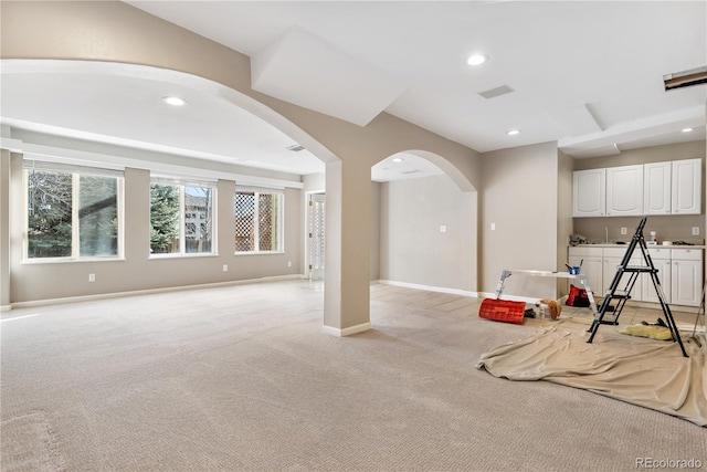 game room with light colored carpet