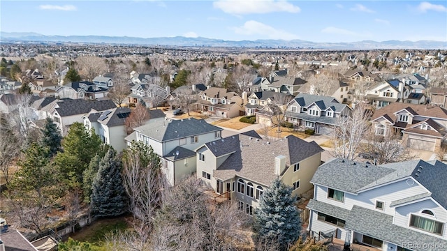 birds eye view of property with a mountain view