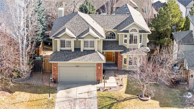 view of front of home with a garage and a front lawn