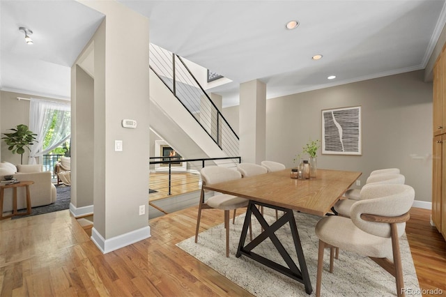 1635 N Franklin St, Denver, CO 80218 - dining space with light wood-type flooring, baseboards, ornamental molding, recessed lighting, and stairway