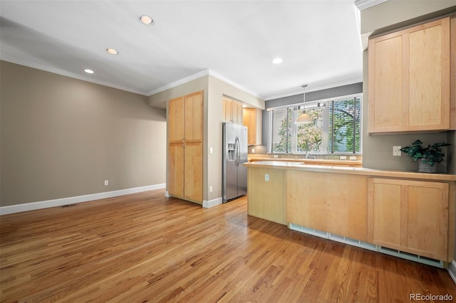 1635 N Franklin St, Denver, CO 80218 - kitchen with stainless steel refrigerator with ice dispenser, light brown cabinets, crown molding, a peninsula, and light wood finished floors