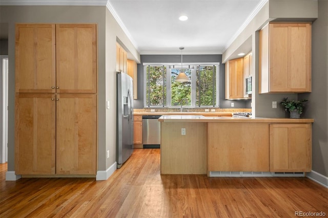 1635 N Franklin St, Denver, CO 80218 - kitchen with appliances with stainless steel finishes, light wood-style flooring, crown molding, a peninsula, and a sink