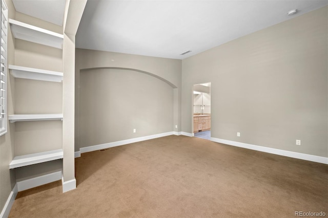 1635 N Franklin St, Denver, CO 80218 - carpeted spare room with baseboards and a sink