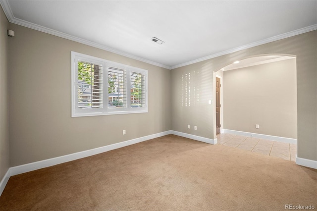 1635 N Franklin St, Denver, CO 80218 - spare room with arched walkways, light carpet, crown molding, and baseboards
