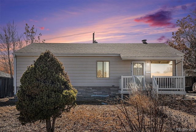 view of front of house featuring roof with shingles