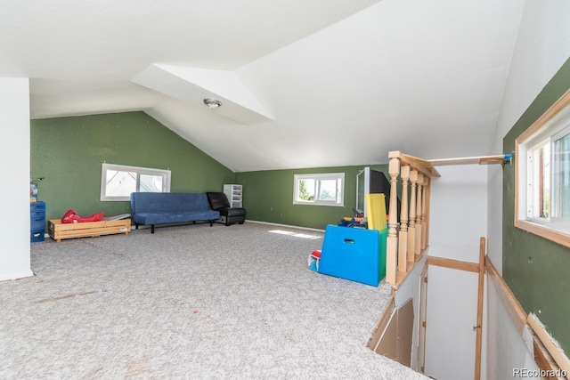 rec room with carpet, vaulted ceiling, and baseboards