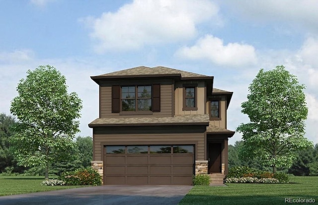 view of front facade featuring a front yard and a garage