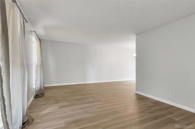 1005 S Lewiston Way, Aurora, CO 80017 - spare room with light wood finished floors and baseboards