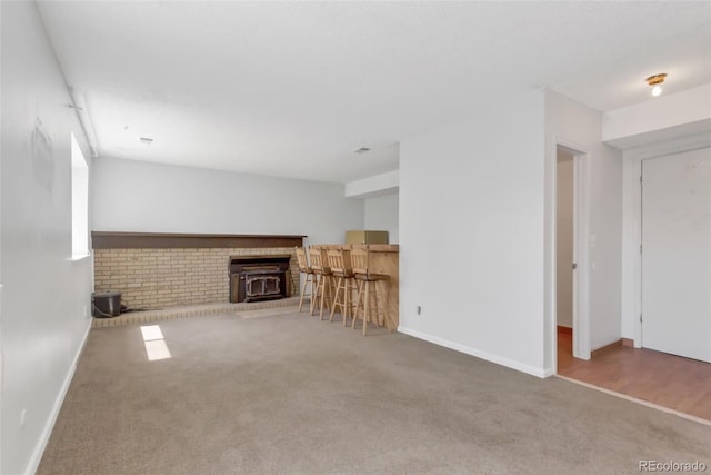 1005 S Lewiston Way, Aurora, CO 80017 - unfurnished living room featuring carpet floors and baseboards