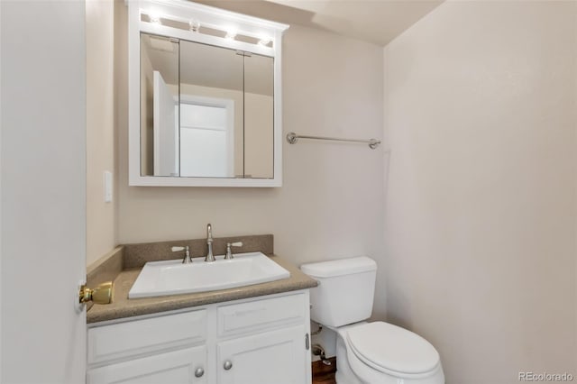 1005 S Lewiston Way, Aurora, CO 80017 - bathroom featuring toilet and vanity