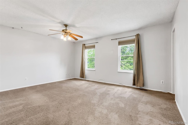 1005 S Lewiston Way, Aurora, CO 80017 - unfurnished room featuring a ceiling fan, carpet, baseboards, and a textured ceiling
