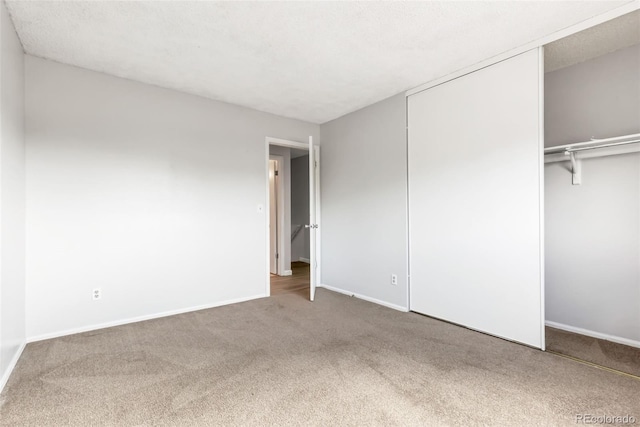 1005 S Lewiston Way, Aurora, CO 80017 - unfurnished bedroom with carpet flooring, a closet, and baseboards