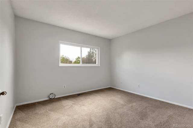 1005 S Lewiston Way, Aurora, CO 80017 - carpeted empty room featuring baseboards