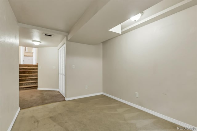 1005 S Lewiston Way, Aurora, CO 80017 - below grade area with carpet flooring, stairs, and baseboards