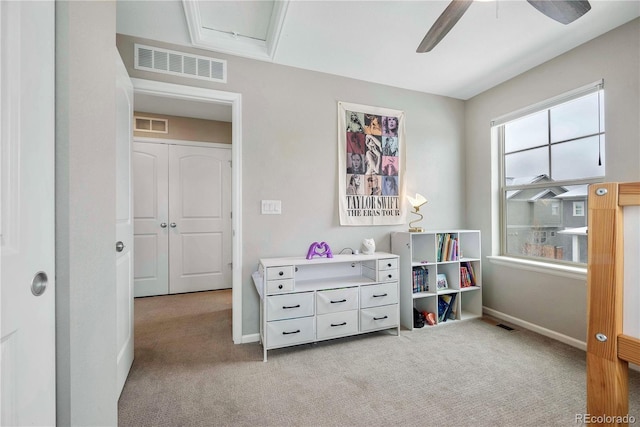 game room with plenty of natural light, light carpet, and ceiling fan