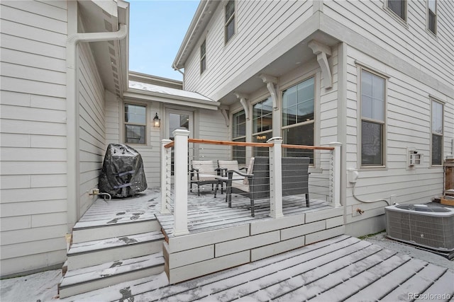 wooden terrace featuring cooling unit and grilling area