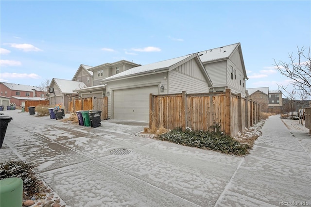 view of side of property with a garage