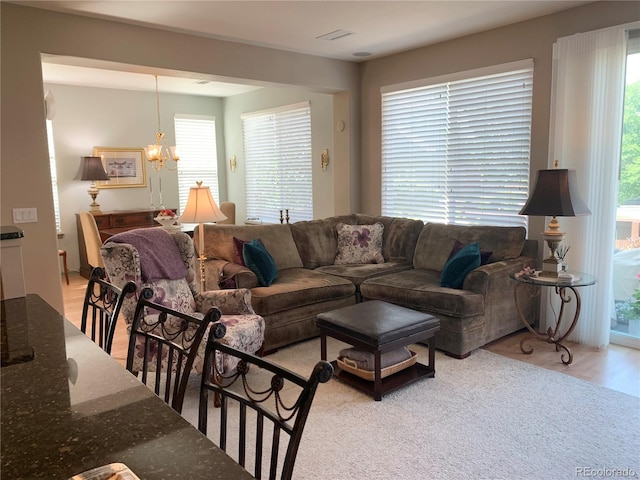 living area with a notable chandelier