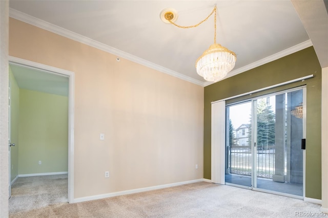 carpeted empty room with baseboards, a chandelier, and ornamental molding