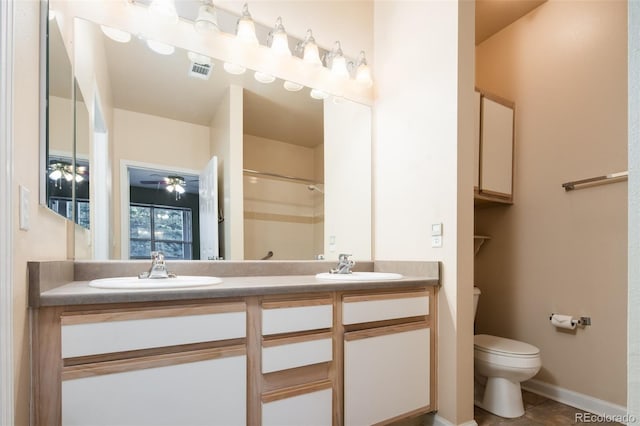 full bathroom with walk in shower, toilet, visible vents, and a sink