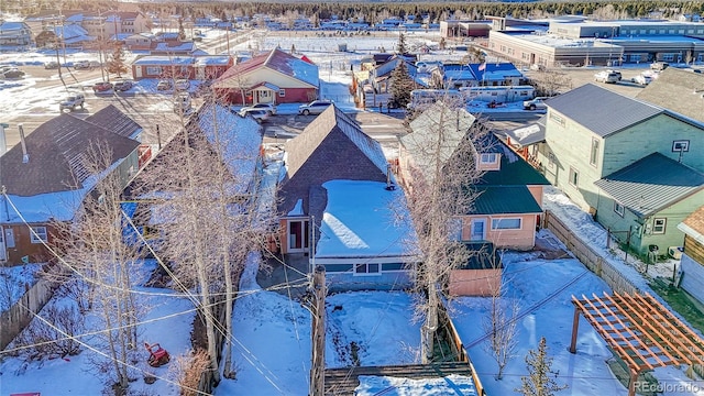 snowy aerial view featuring a residential view