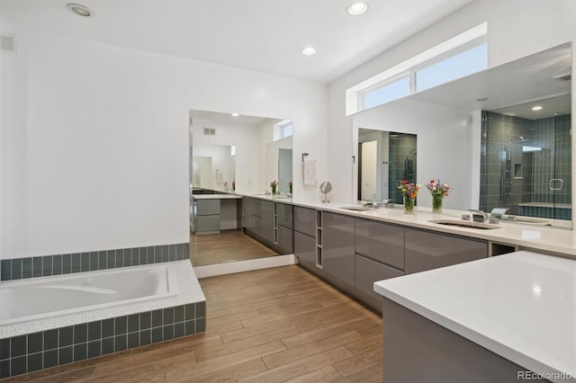 1711 Boulder St, Denver, CO 80211 - full bathroom with a shower stall, vanity, wood finished floors, and a bath