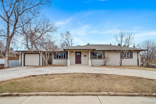 ranch-style house featuring a garage