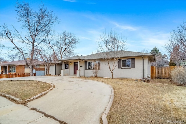 ranch-style house featuring a garage