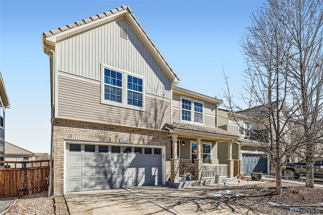 view of front of home with brick siding, a porch, an attached garage, fence, and driveway