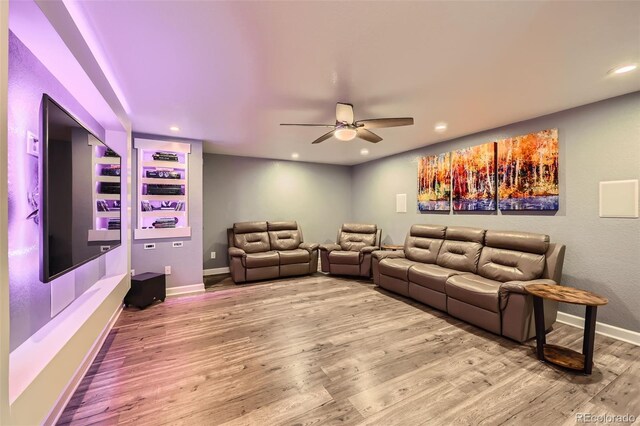 cinema featuring ceiling fan, recessed lighting, wood finished floors, and baseboards