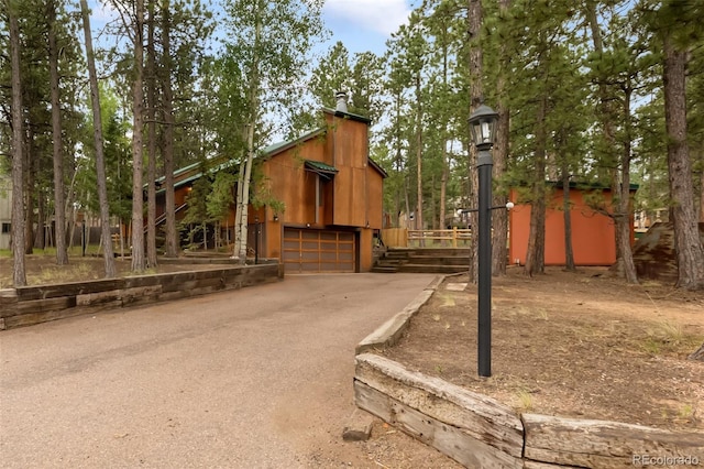 1343 Terri Ln, Woodland Park, CO 80863 - surrounding community with driveway and an attached garage