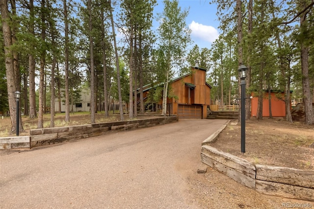 1343 Terri Ln, Woodland Park, CO 80863 - view of yard featuring driveway and a garage