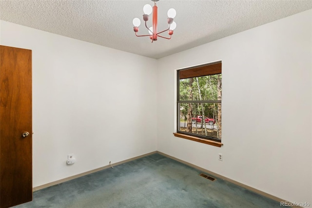 1343 Terri Ln, Woodland Park, CO 80863 - carpeted spare room featuring a chandelier and a textured ceiling