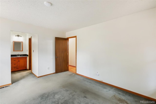 1343 Terri Ln, Woodland Park, CO 80863 - unfurnished bedroom with baseboards and light colored carpet