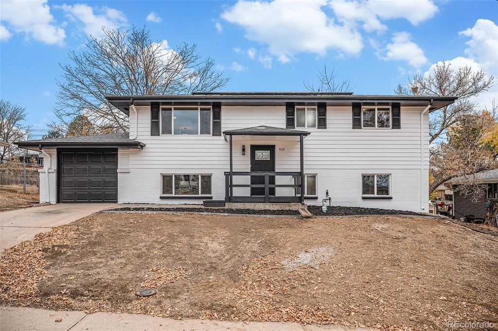 split foyer home featuring a garage