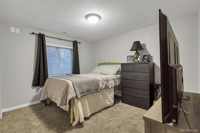 bedroom with visible vents, baseboards, carpet, and a textured ceiling