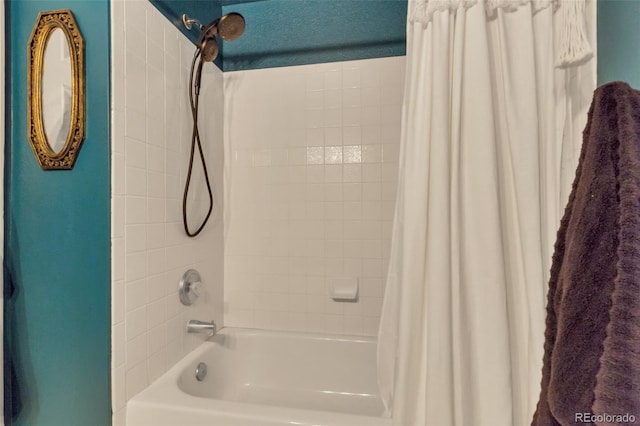 bathroom with shower / bath combination with curtain