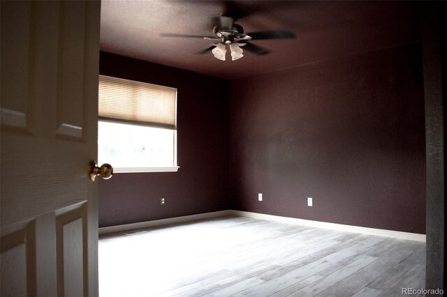 11384 Oakland Dr, Commerce City, CO 80640 - spare room with ceiling fan, wood finished floors, and baseboards