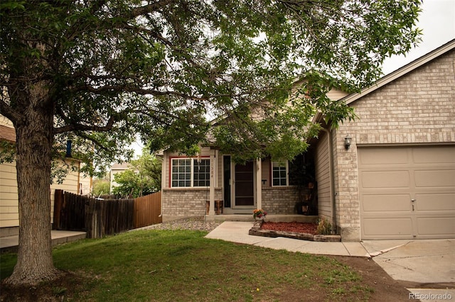 11384 Oakland Dr, Commerce City, CO 80640 - obstructed view of property with brick siding and a garage
