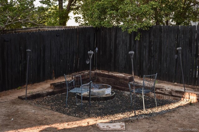 11384 Oakland Dr, Commerce City, CO 80640 - view of yard featuring an outdoor fire pit