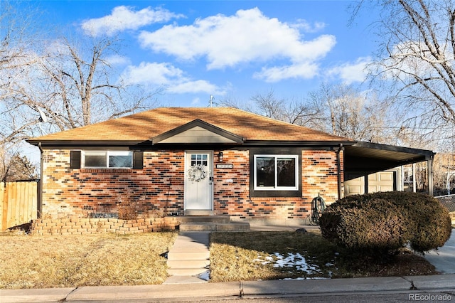 view of front of property featuring a carport