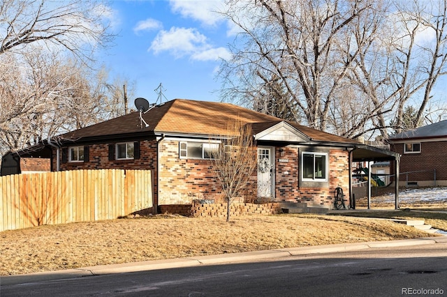 ranch-style home featuring a carport