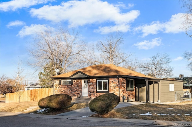 view of front of property featuring a carport